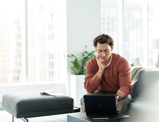 A man does work on a coach