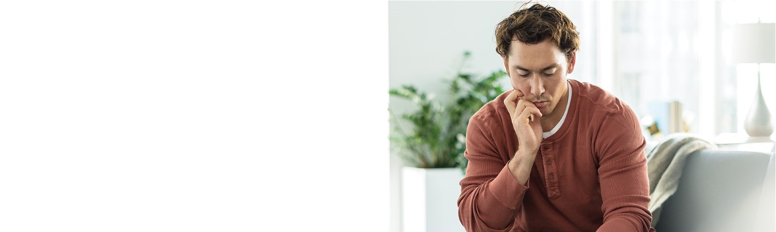 A man doing work on a couch