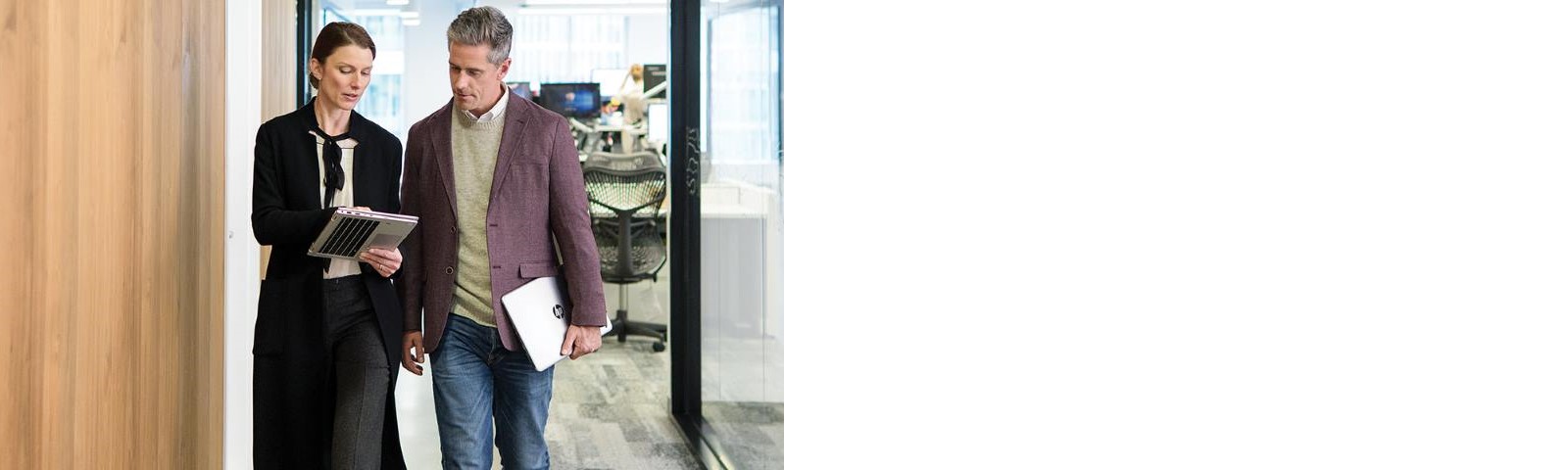 Two people in a hallway