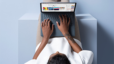 Man working on laptop, birds eye view