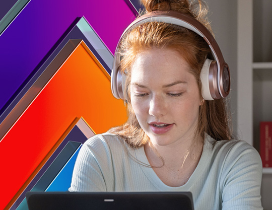 Image of young girl, headphones on and using a Surface surrounded by Skilling branding - bright pops of purple and orange