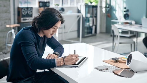 Man working on his device